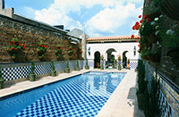 Custom tiled pool patio walls by Eugenia Talbott